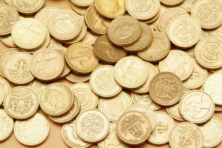 Five arrests in fake coin probe