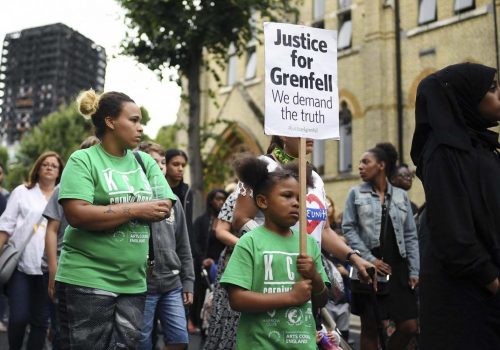 Hundreds join silent march demanding justice for Grenfell