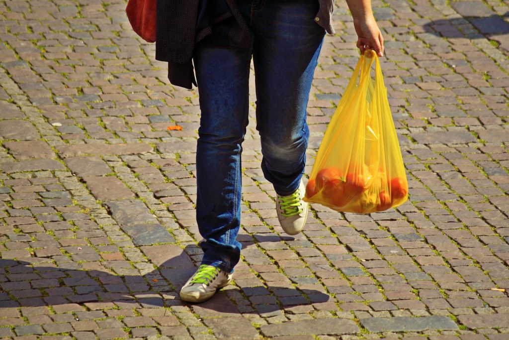 Plastic bag sales in England halved in past year