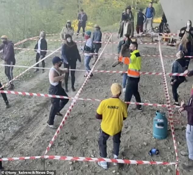 Slovakian revellers dance in penned-off squares at socially distanced outdoor rave