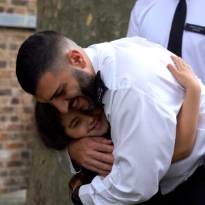 Seven-year-old victim meets officer PC Ahmet Mavitunali who saved her life