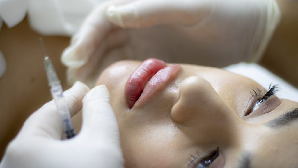 Cosmetic surgery ads to be banned for under-18s